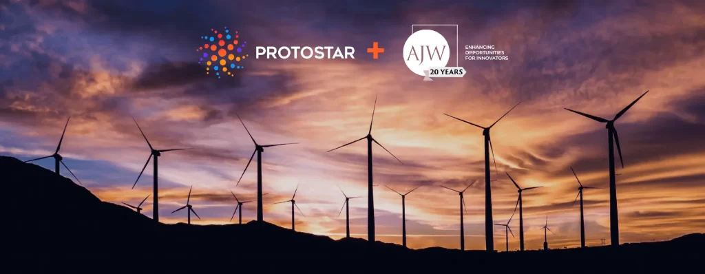 Wind turbines at dusk with Protostar and AJW logos
